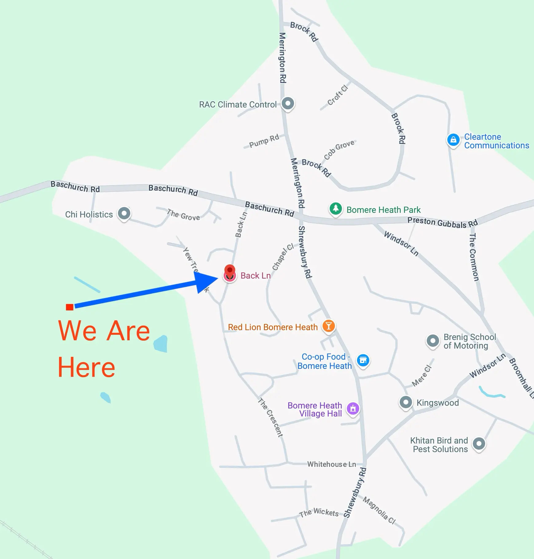 Rainbow over grassy landscape with car